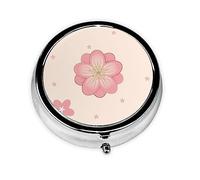 Pastillero redondo de flores de cerezo rosado. Organizador portátil de medicamentos diario, diseño fácil de viajar.