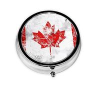 Pastillero redondo retro con la bandera de Canadá. Organizador portátil de medicamentos diario, diseño fácil de transportar.