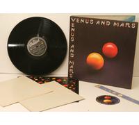 PAUL MCCARTNEY. WINGS. - PAUL MCCARTNEY. WINGS., Venus and Mars. COMPLETE WITH 2 POSTERS AND 2 STICKERS. Top copy. Very rare.First UK pressing. 1975. Record label: Capitol