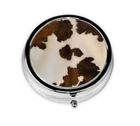 Piel de vaca abstracta. Este pequeño pastillero redondo impreso es un organizador portátil de píldoras y vitaminas perfecto para bolsillos, bolsos y viajes.