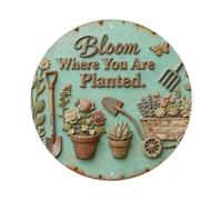 Placa metálica con texto en inglés "Bloom Where You Are Planted"