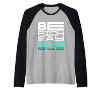 Sé rico, mantente humilde: una declaración para mentes impulsadas por un propósito Camiseta Manga Raglan