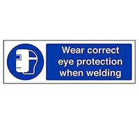 Señal de obligación en inglés de VSafety Signs (41059AX-R), con lema «Wear Correct Eye Protection When Welding»; plástico rígido, horizontal, 300 x 100 mm en color azul