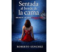 Sentada al borde de la cama