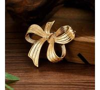 Shein 1 pieza Broche minimalista de lazo 3D dorado, accesorio elegante de vacaciones para mujeres. Disponible en diseños de lazo de cinta curva, incrustació