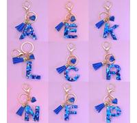 Shein 1 pieza Llavero con forma de alfabeto inglés con colgante de corazón de resina poliéster con lentejuelas azules y decoración con borla, regalo, acceso