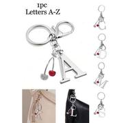 Shein 1 pieza Llavero elegante y premium de letra plateada con decoración de cereza con diamante, colgante 3D de alfabeto A-Z, llavero de aleación de moda,
