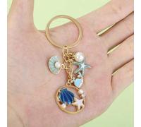 Shein 1 pieza Llavero unisex con colgante de estilo playa de estrella de mar, concha, perla y delfín con motivos de la vida marina