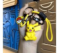 Shein Colgantes y llaveros de la serie Pokémon, Pikachu amarillo, elaborados con PVC de alta calidad, con una cuerda colorida, un dije de Poké Ball y un bro
