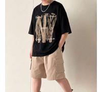 Shein Conjunto de 2 piezas para niño preadolescente: camiseta negra de cuello redondo y manga corta con estampado de letra grande estilo universitario casua