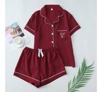 Shein Conjunto de pijama de 2 piezas con blusa de manga corta con cuello polo, bolsillo y bordado de corazón, y shorts con moño, en unicolor con ribete en c