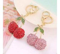Shein Llavero adorable de cereza con pom pom peludo, de mochila lindo de cereza para bolsos, ornamento de moda elegante con mosquetón de metal, pequeño y l