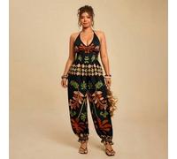 Shein Mono de talla grande para mujer con estampado de plantas tropicales en negro, mono con tirantes finos, cuello en V y cintura con lazo, largo hasta el