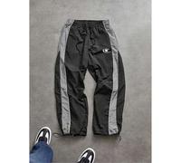 Shein Pantalones deportivos para hombres con diseño de patchwork a rayas y contraste de colores, con cintura con cordón, pierna recta suelta, con estampado