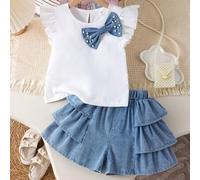 Shein Set de 2 piezas de camiseta de manga corta con lazo 3D y pantalones cortos de mezclilla con dobladillo fruncido holgado para niñas, primavera/verano