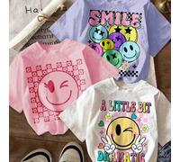 Shein Set de 3 camisetas de manga corta y cuello redondo con estampados de cuadros, flores y caritas sonrientes para niñas preadolescentes, en colores blanc