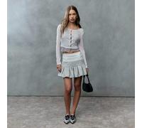 Shein Toda la diversión de una falda de tenis coqueta pero con la comodidad de tu chándal favorito. Esta mini plisada suave está hecha de tela de felpa cómo