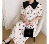 Shein Vestido de niña de color blanco crema, con un gran cuello Peter Pan negro que le da un toque retro y dulce, con un estampado de lazos verticales por t