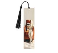 Sillón con una pila de libros, marcapáginas de madera con borlas, letrero de madera para manualidades, marcadores de libros para lectores amantes de los libros