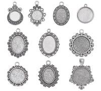 SUNNYCLUE 1 caja 40 bandejas Colgantes con Biseles de Cabujón de 12 mm ~ 18x25 mm, Cabujones Ovalados Redondos, Estilo Vintage, Plata Antigua, Bandeja de Bisel En Blanco, Foto Conmemorativa, Dijes par