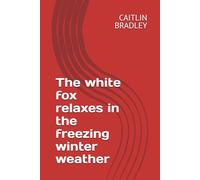 The white fox relaxes in the freezing winter weather