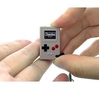 TinyCircuits Thumby - Llavero programable para consola de juegos, mini consola retro para juegos, aprendizaje STEM, recargable por USB, 5 juegos precargados (gris)