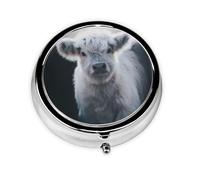 Vaca gris. Este pequeño pastillero redondo es un organizador portátil de medicamentos de viaje con tres compartimentos para almacenar medicamentos diarios.