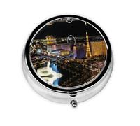 Vista nocturna de Las Vegas. Este pequeño pastillero redondo es un organizador portátil de medicamentos de viaje con tres compartimentos para almacenar medicamentos diarios.