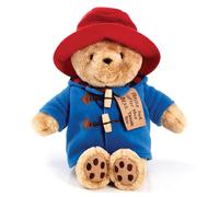 Vistiendo su tradicional trenca. Suave y tierno oso Paddington sentado.